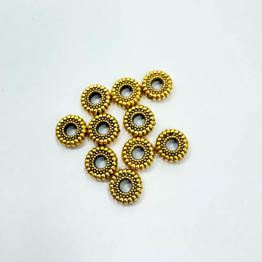 Set de 10 cuentas cilindro oro Bisutería